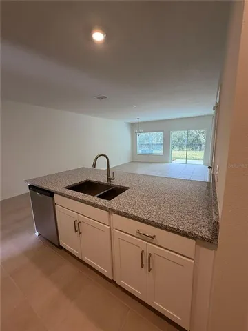 a kitchen with sink and window
