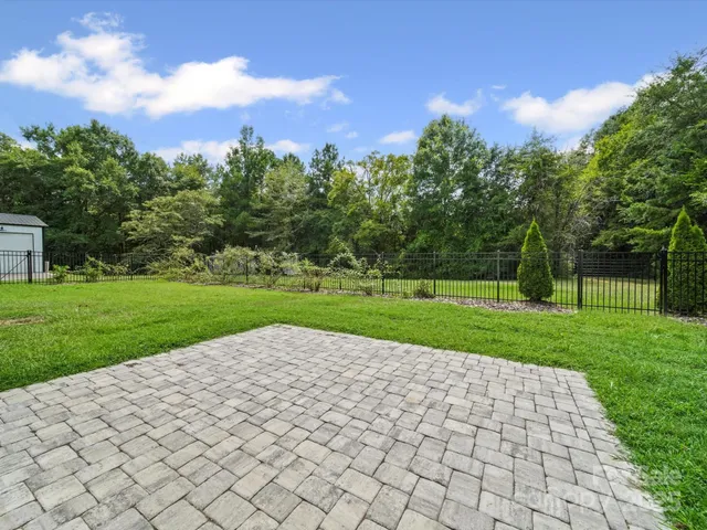 a view of a park with large trees