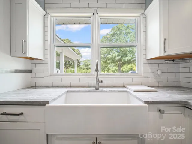 a white bath tub sitting next to a window