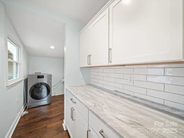 a view of a kitchen with washer and dryer