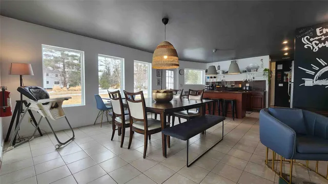 a view of a dining room with furniture window and outside view