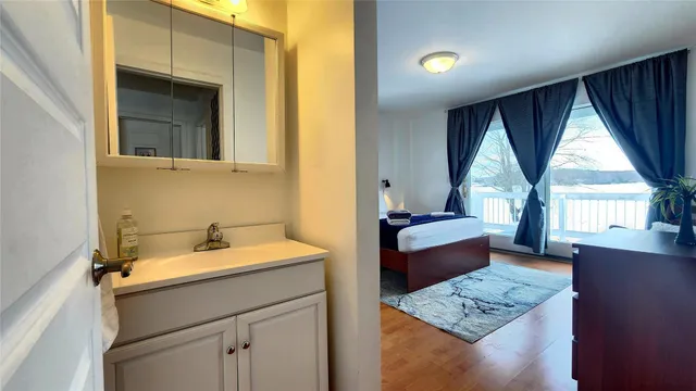 a bedroom with a bed and chair