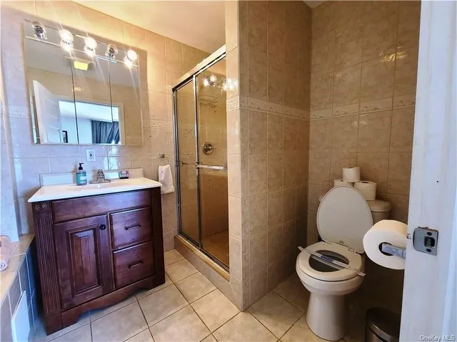 a bathroom with a sink a toilet and bathtub