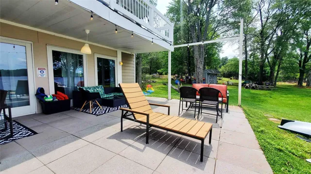 an outdoor space with furniture and garden view