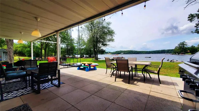 a view of a patio with a table and chairs