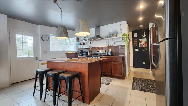 a kitchen with a table and chairs in it