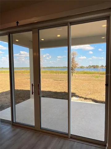 a view of a glass door and porch
