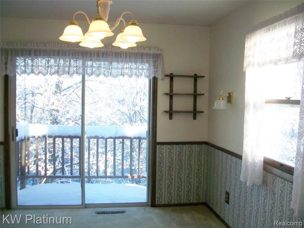 7880 Graham Road Jeddo, MI 48032 - Photo 3 of 14 Exceptional dining room view year round - perfect setting for family dinners overlooking the wooded yard.