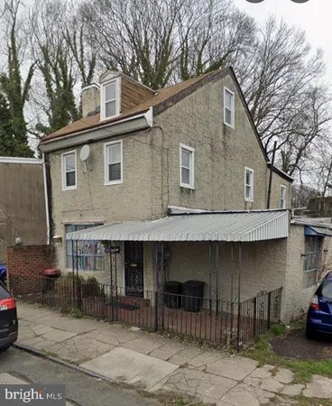 a front view of a house with parking space