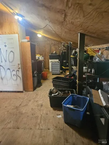 a kitchen with stainless steel appliances kitchen island granite countertop a sink a stove and a refrigerator