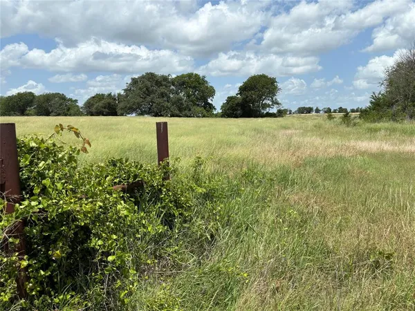a view of a lake with a house in the background