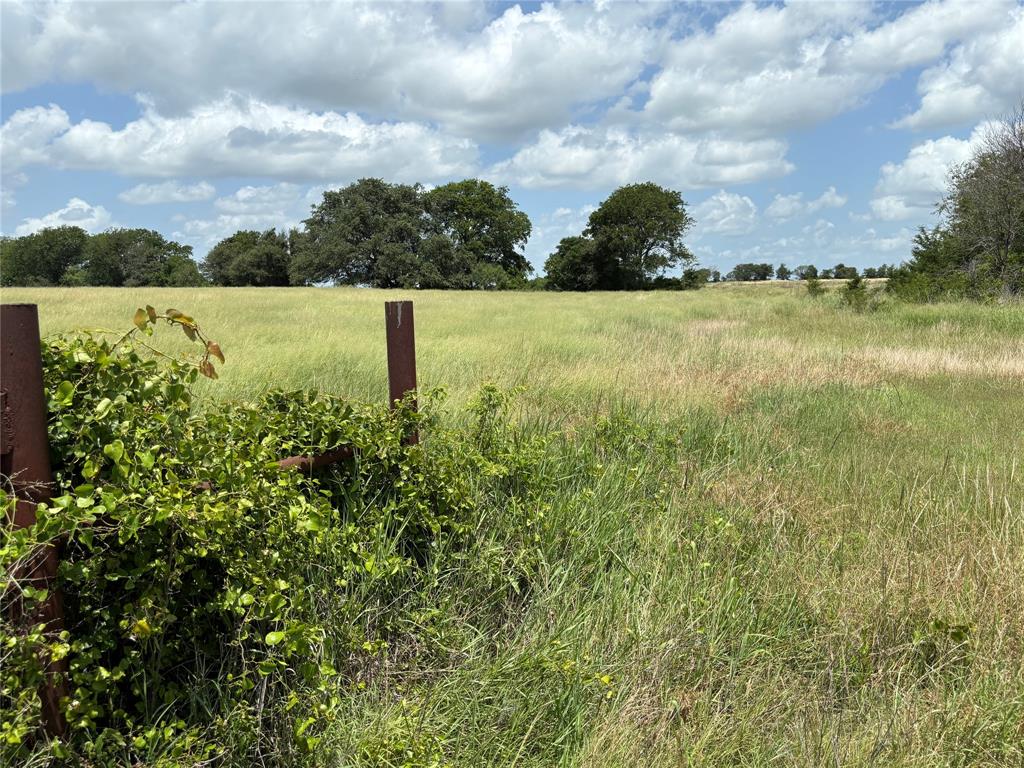 a view of a lake with a house in the background