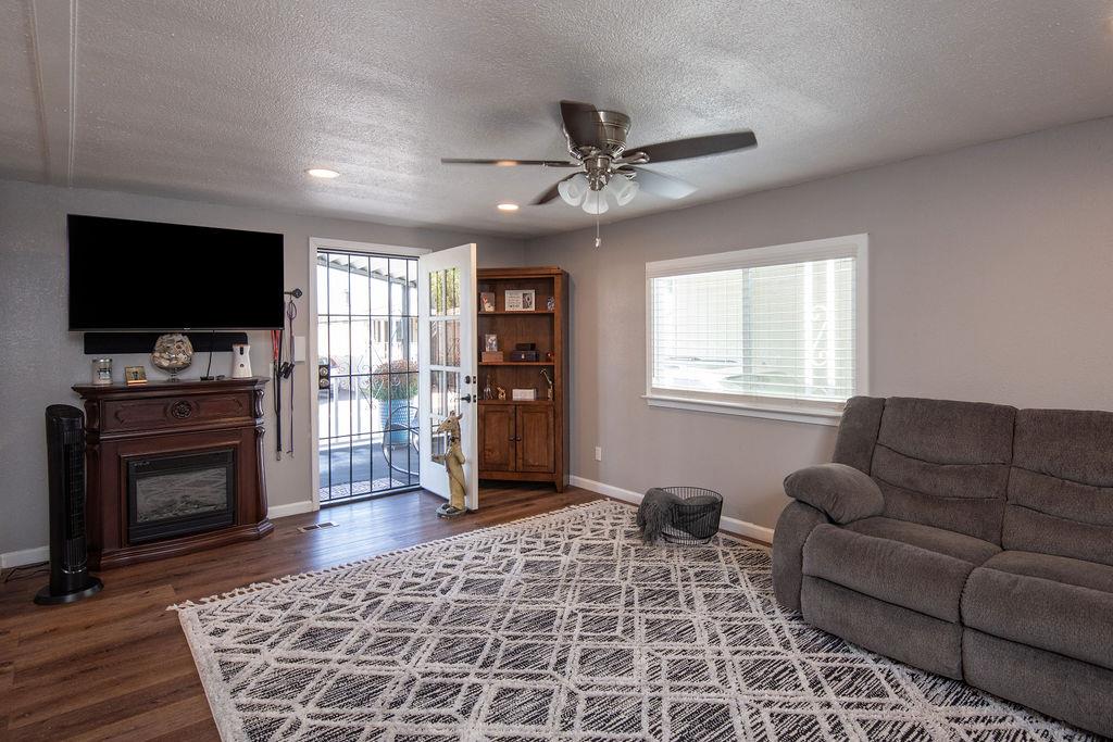 107 Schooner Lane Modesto, CA 95356 - Photo 16 of 43 a living room with furniture and a flat screen tv