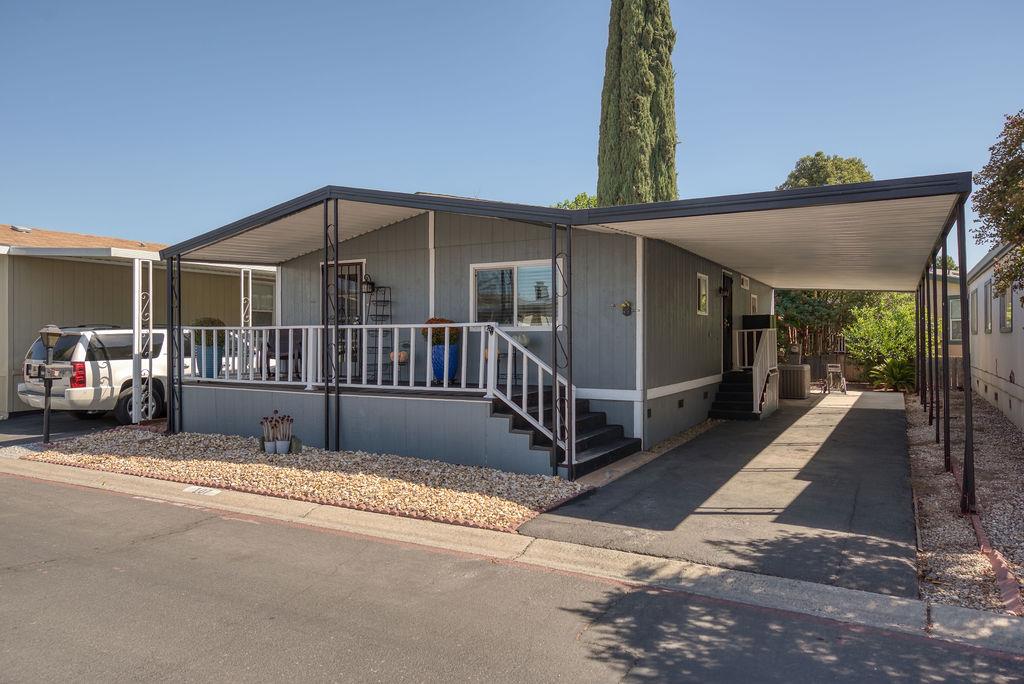107 Schooner Lane Modesto, CA 95356 - Photo 2 of 43 a view of a house with a cars park side of a road