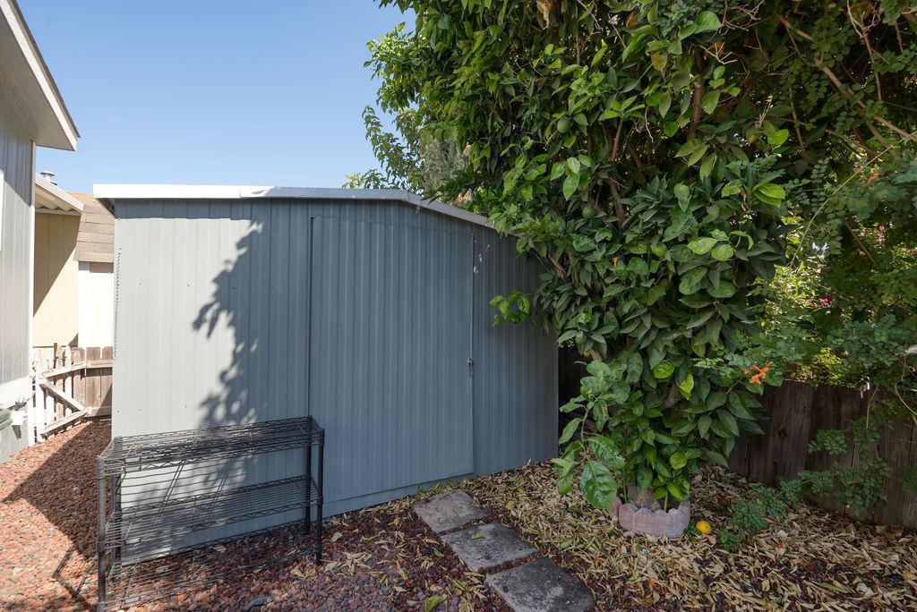 107 Schooner Lane Modesto, CA 95356 - Photo 33 of 43 a backyard of a house with lots of green space