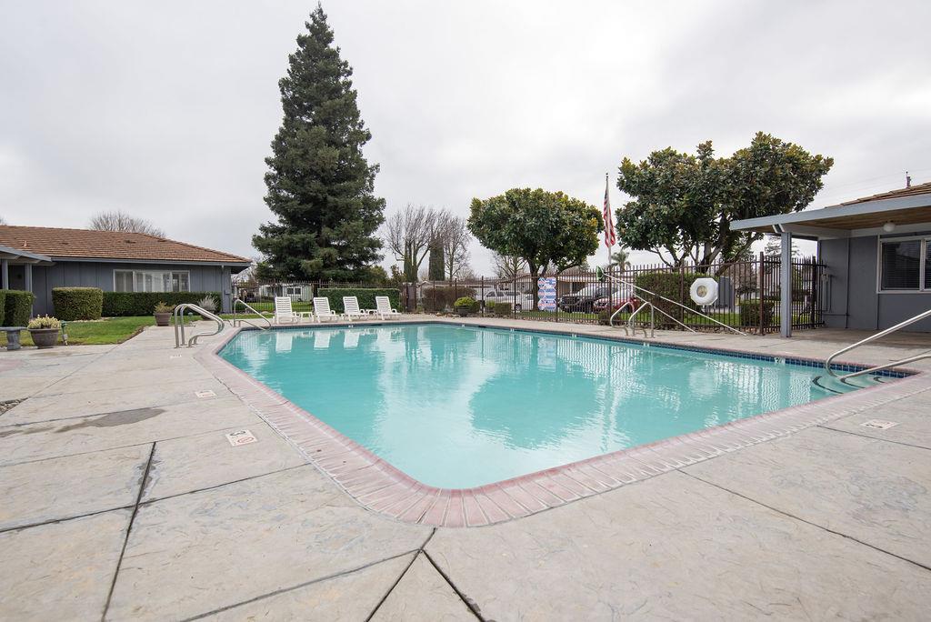 107 Schooner Lane Modesto, CA 95356 - Photo 40 of 43 a view of a swimming pool with a patio