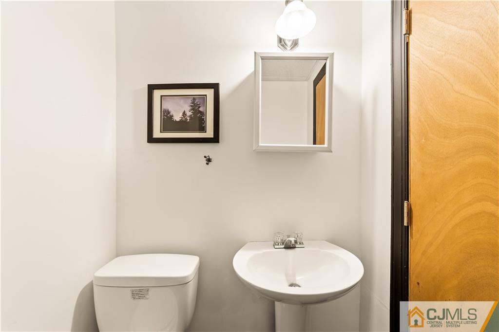 39 Landvale Road Spotswood, NJ 08884 - Photo 29 of 34 a bathroom with a toilet sink and mirror