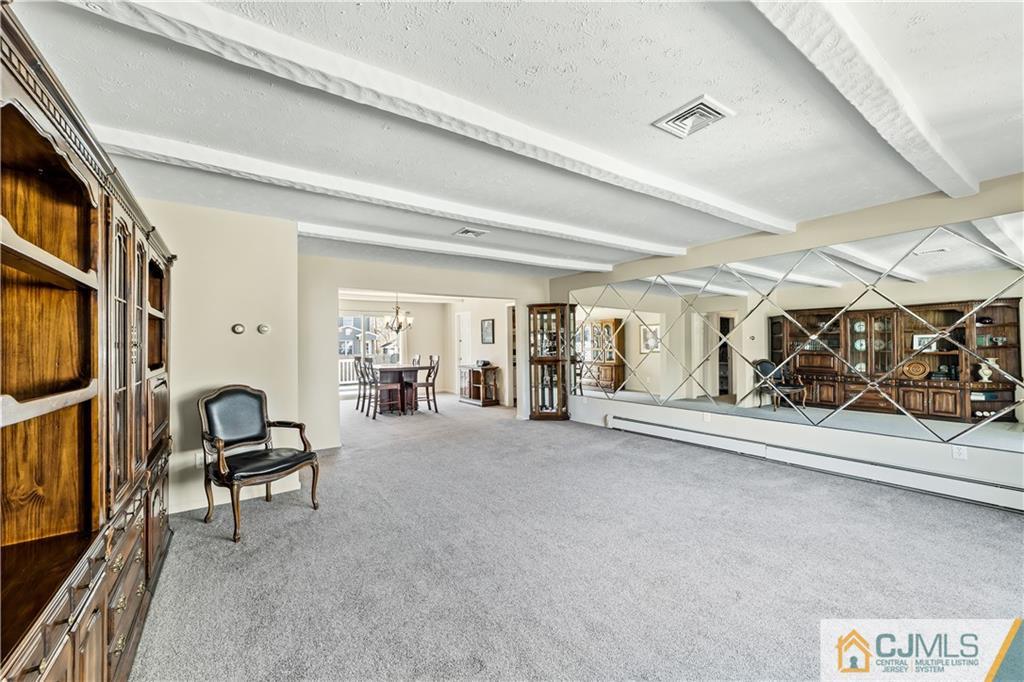 39 Landvale Road Spotswood, NJ 08884 - Photo 4 of 34 a view of a livingroom with furniture and toys