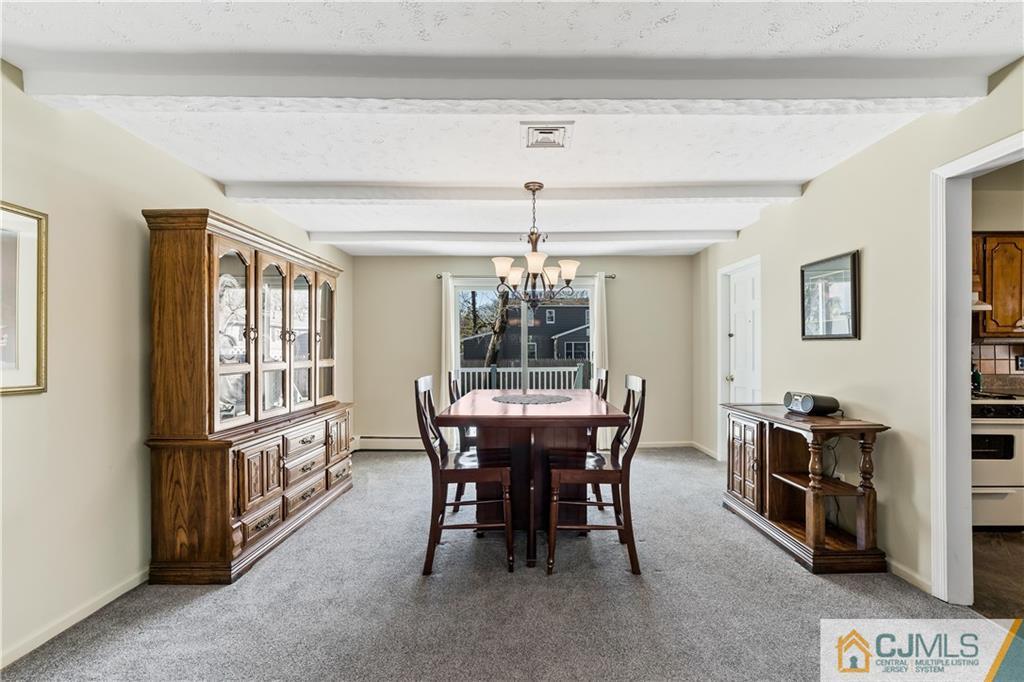 39 Landvale Road Spotswood, NJ 08884 - Photo 6 of 34 a view of a dining room with furniture window and outside view