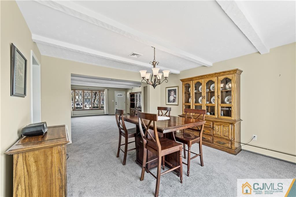 39 Landvale Road Spotswood, NJ 08884 - Photo 7 of 34 a view of a dining room with furniture and window