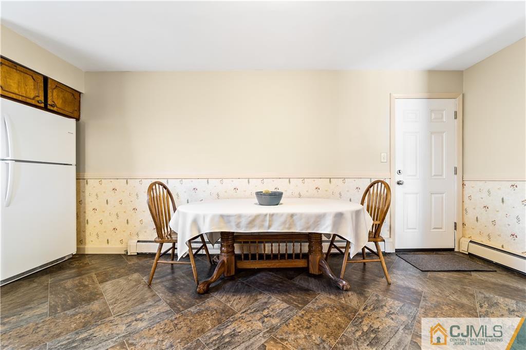 39 Landvale Road Spotswood, NJ 08884 - Photo 10 of 34 a bedroom with a bed and a table in it