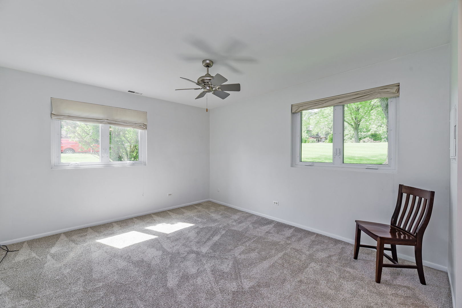 1464 Stonebridge Circle, Unit E3 Wheaton, IL 60189 - Photo 7 of 9 a view of an empty room with a window