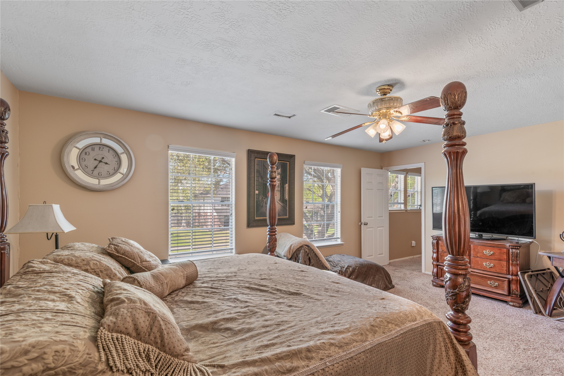 3727 Oaklace Drive Spring, TX 77389 - Photo 15 of 37 a bedroom with a bed and a flat tv screen on dresser