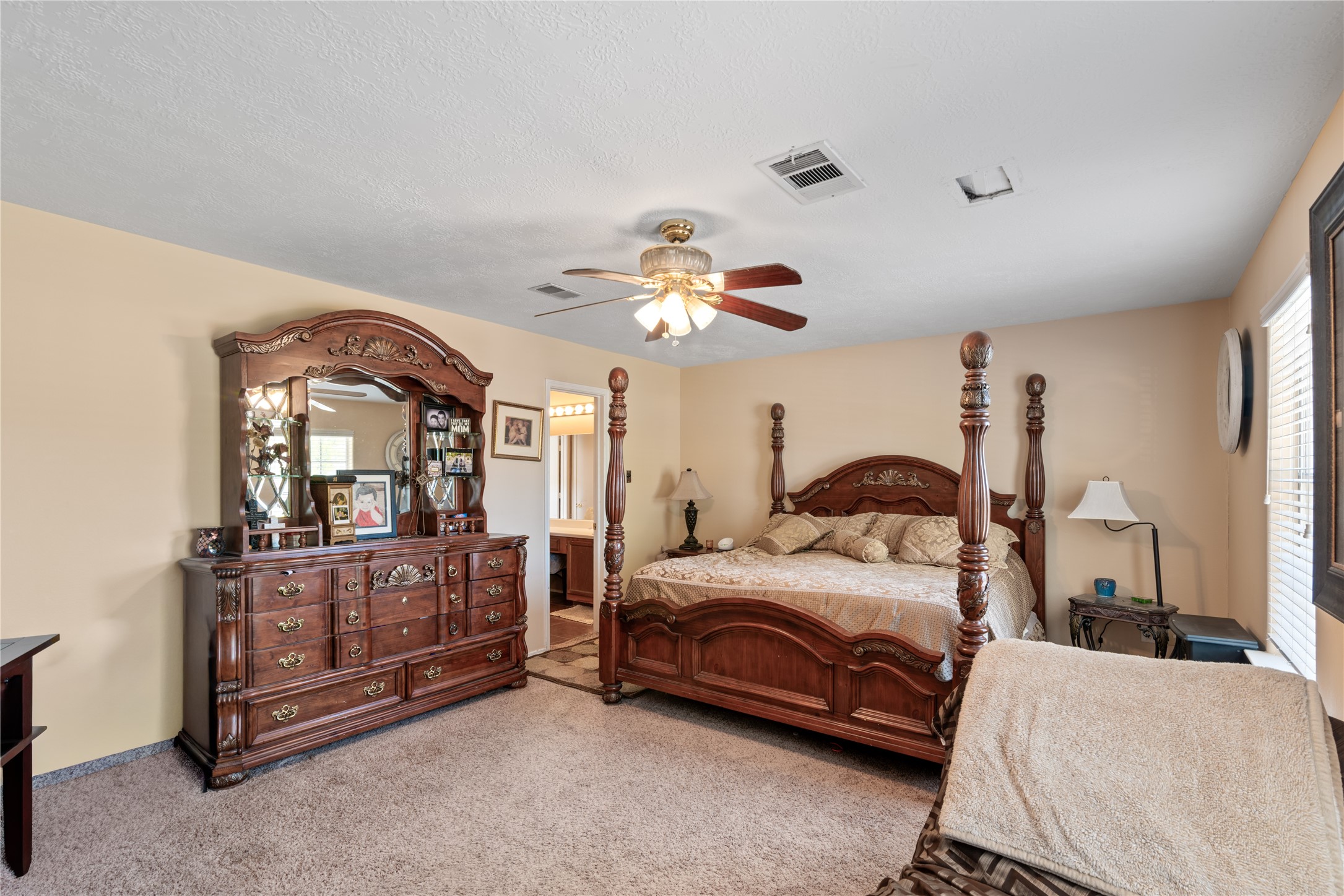 3727 Oaklace Drive Spring, TX 77389 - Photo 16 of 37 a bedroom with a bed and a dresser