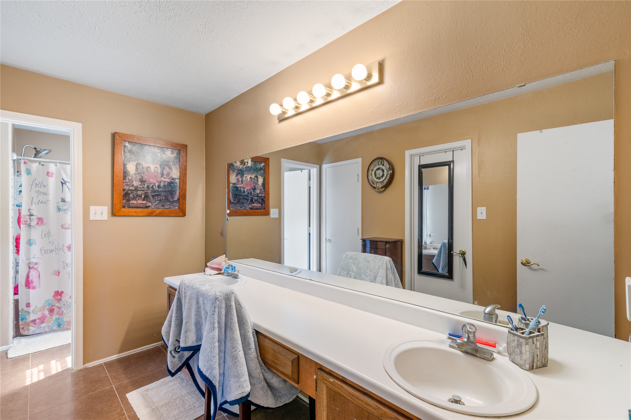 3727 Oaklace Drive Spring, TX 77389 - Photo 18 of 37 a bathroom with a sink vanity mirror and toilet