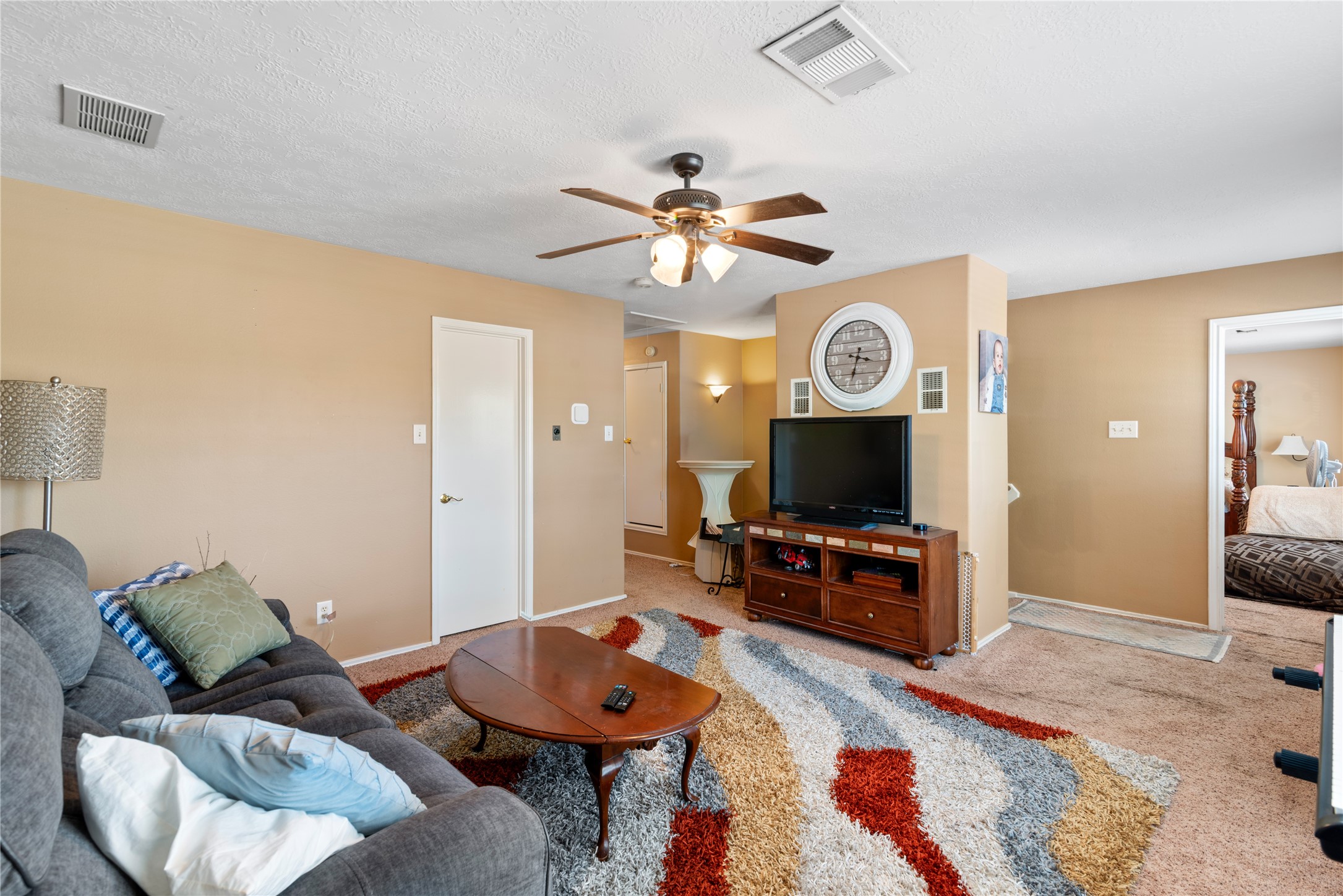 3727 Oaklace Drive Spring, TX 77389 - Photo 20 of 37 a living room with furniture and a flat screen tv