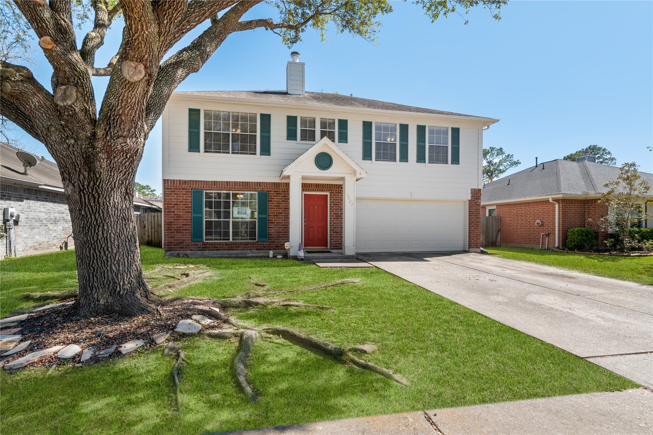 3727 Oaklace Drive Spring, TX 77389 - Photo 3 of 37 a front view of a house with garden