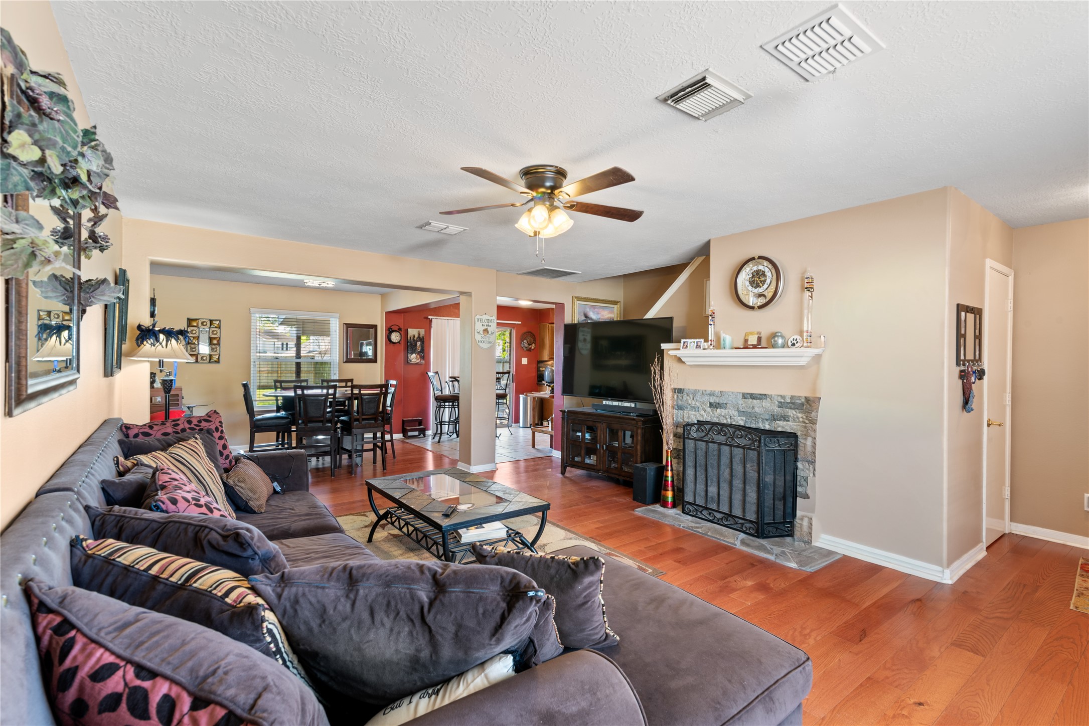 3727 Oaklace Drive Spring, TX 77389 - Photo 5 of 37 a living room with furniture a fireplace and a ceiling fan