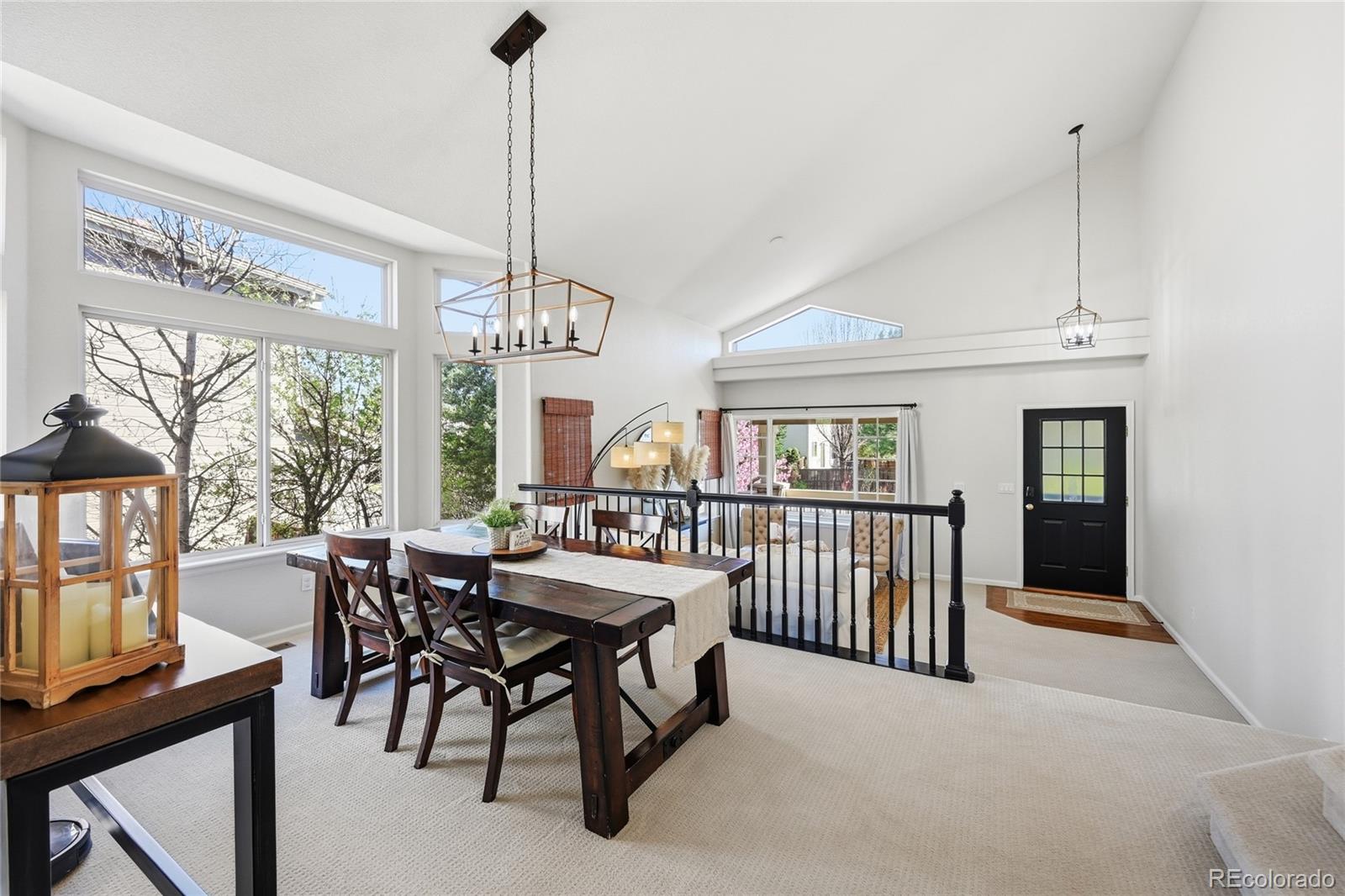 9153 Roadrunner Drive Highlands Ranch, CO 80129 - Photo 14 of 39 a view of a dining room with furniture window and outside view