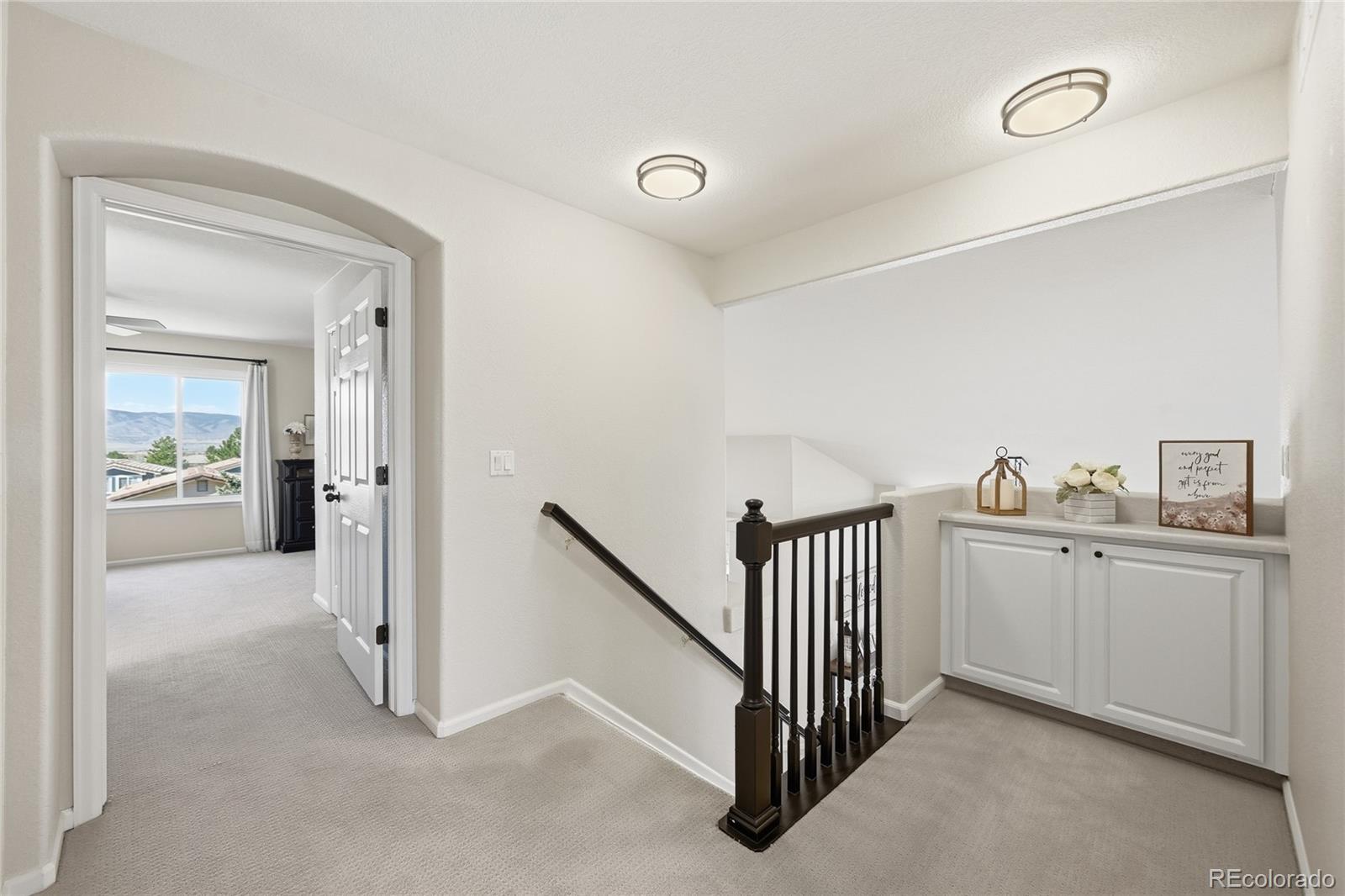 9153 Roadrunner Drive Highlands Ranch, CO 80129 - Photo 26 of 39 a view of a hallway to closet and utility room