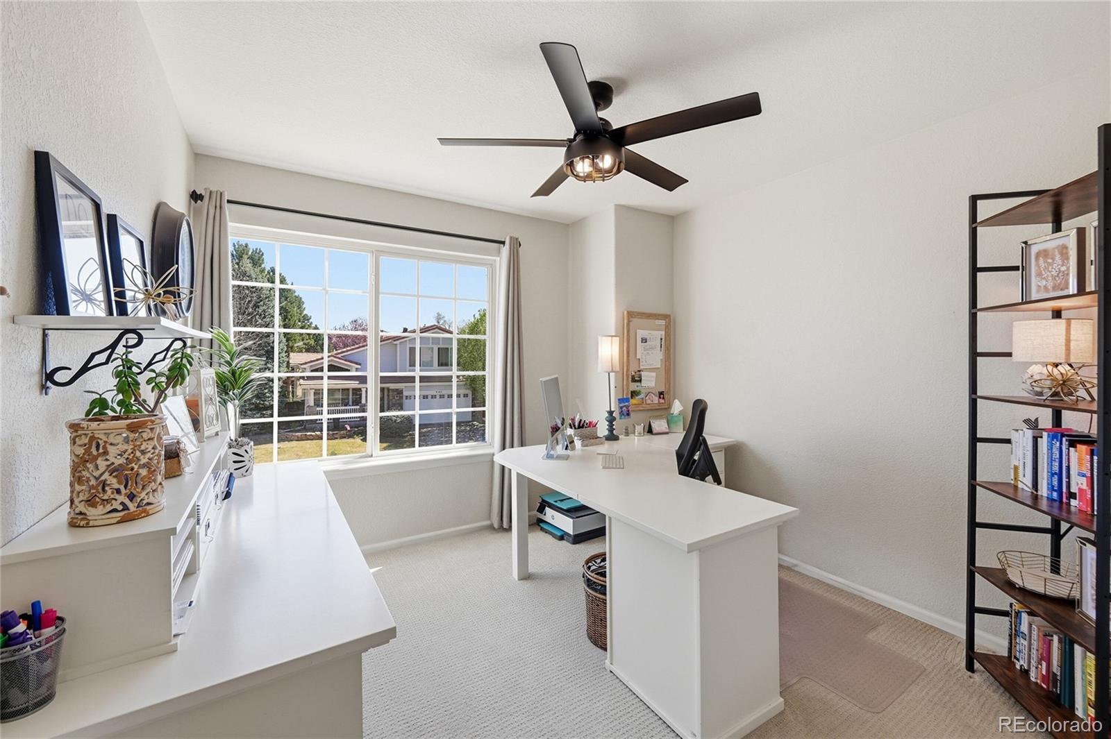 9153 Roadrunner Drive Highlands Ranch, CO 80129 - Photo 27 of 39 a room with a window and gym equipment