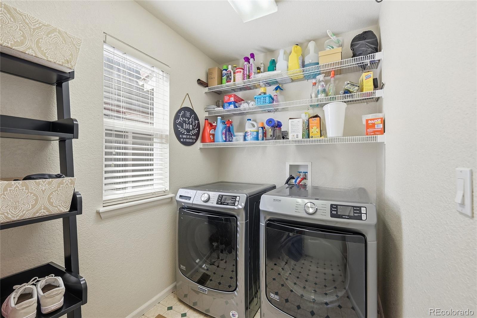 9153 Roadrunner Drive Highlands Ranch, CO 80129 - Photo 29 of 39 a utility room with dryer and washer