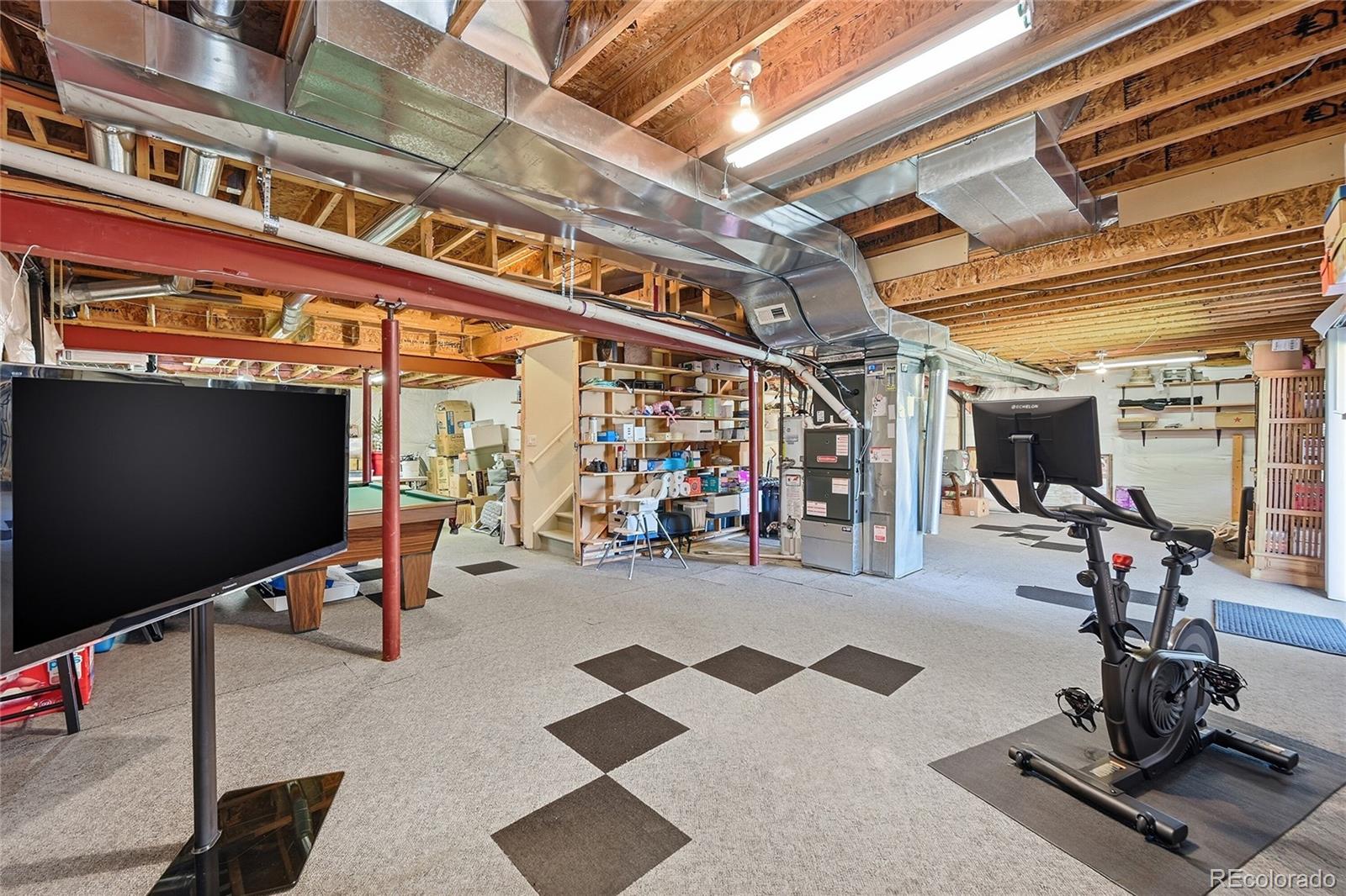 9153 Roadrunner Drive Highlands Ranch, CO 80129 - Photo 30 of 39 a view of a room with gym equipment