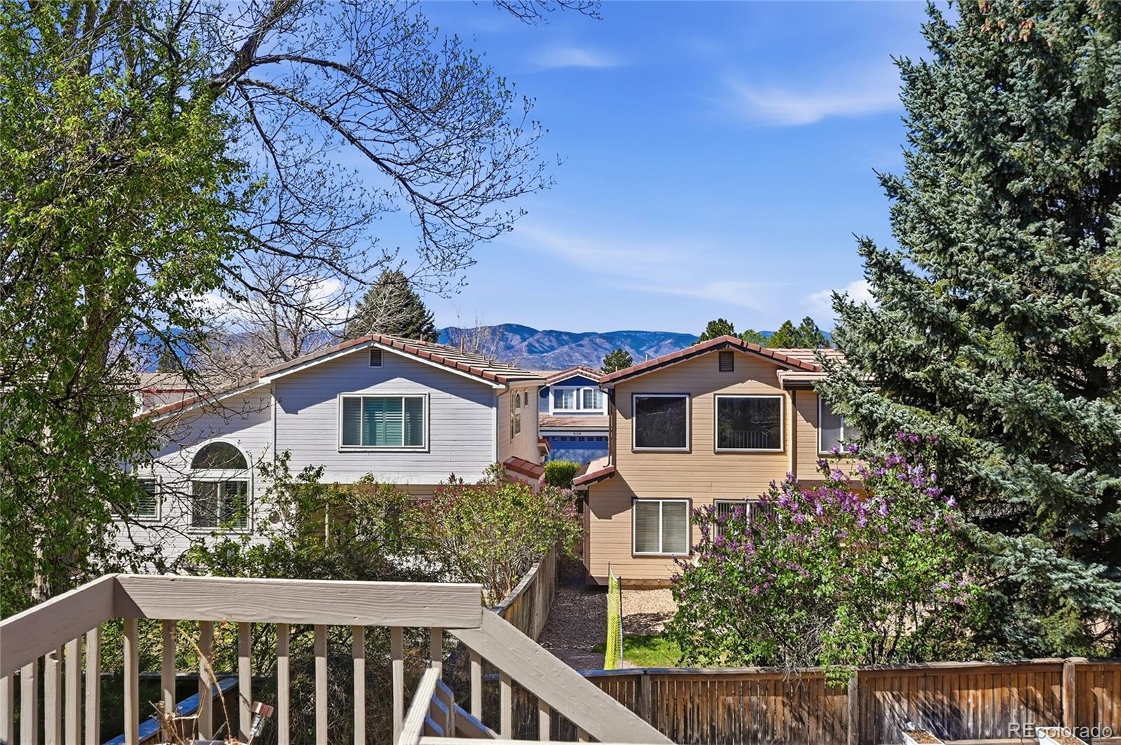 9153 Roadrunner Drive Highlands Ranch, CO 80129 - Photo 33 of 39 a front view of a house with a garden
