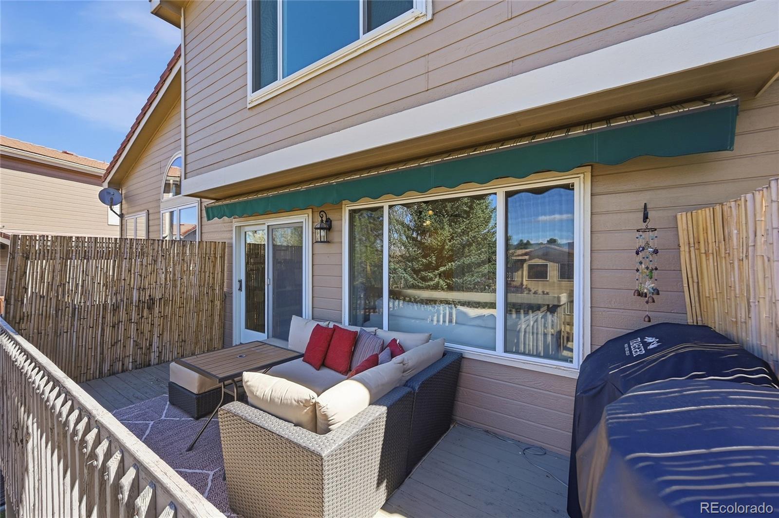 9153 Roadrunner Drive Highlands Ranch, CO 80129 - Photo 35 of 39 a balcony with furniture and a potted plant