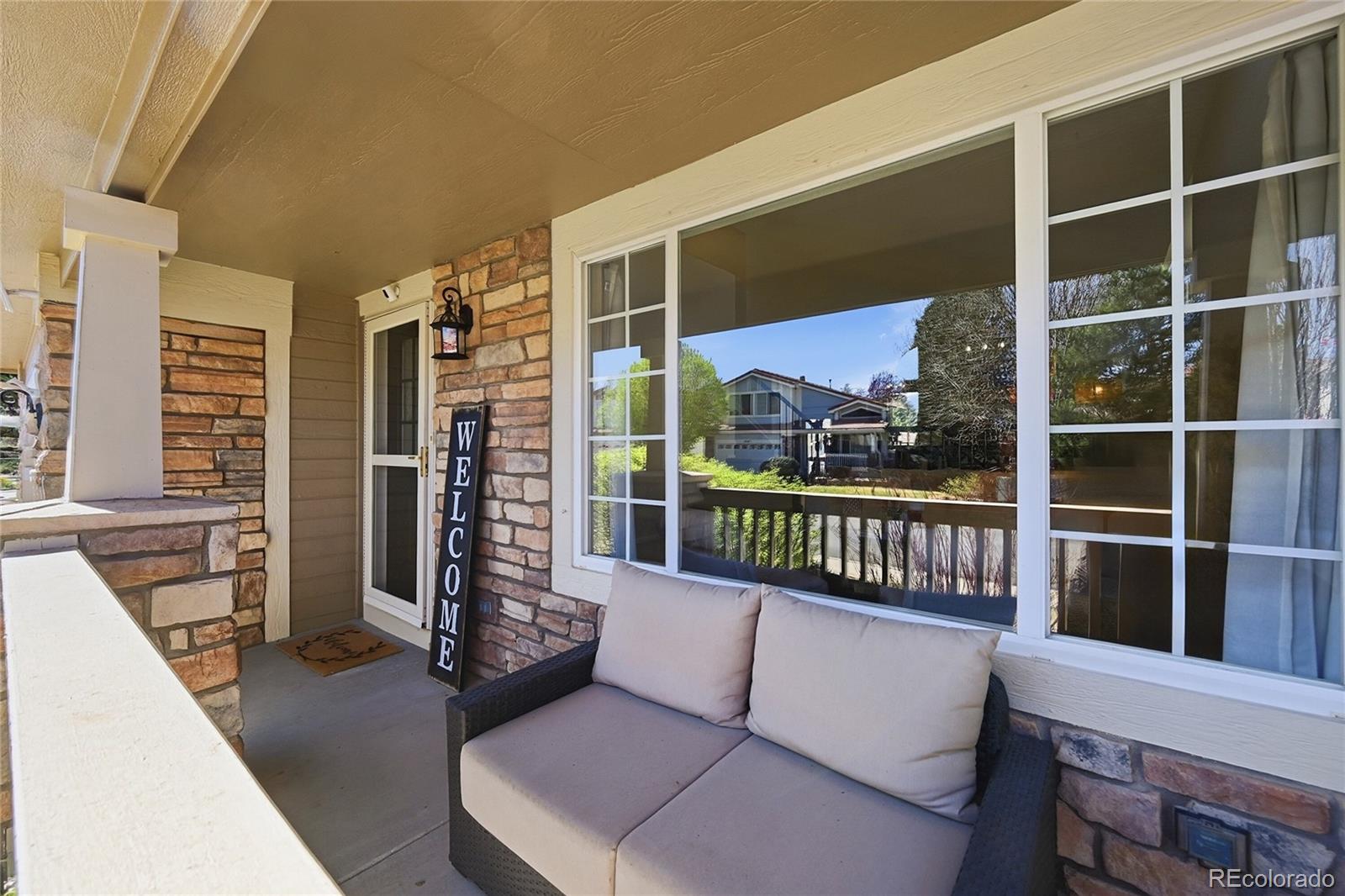 9153 Roadrunner Drive Highlands Ranch, CO 80129 - Photo 4 of 39 a balcony with couch