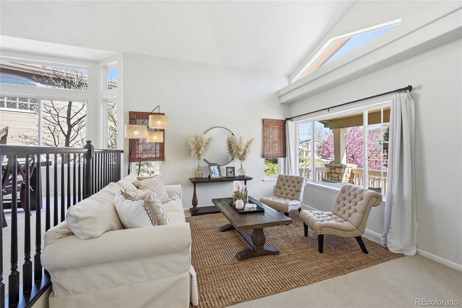 9153 Roadrunner Drive Highlands Ranch, CO 80129 - Photo 6 of 39 a living room with furniture fireplace and a table