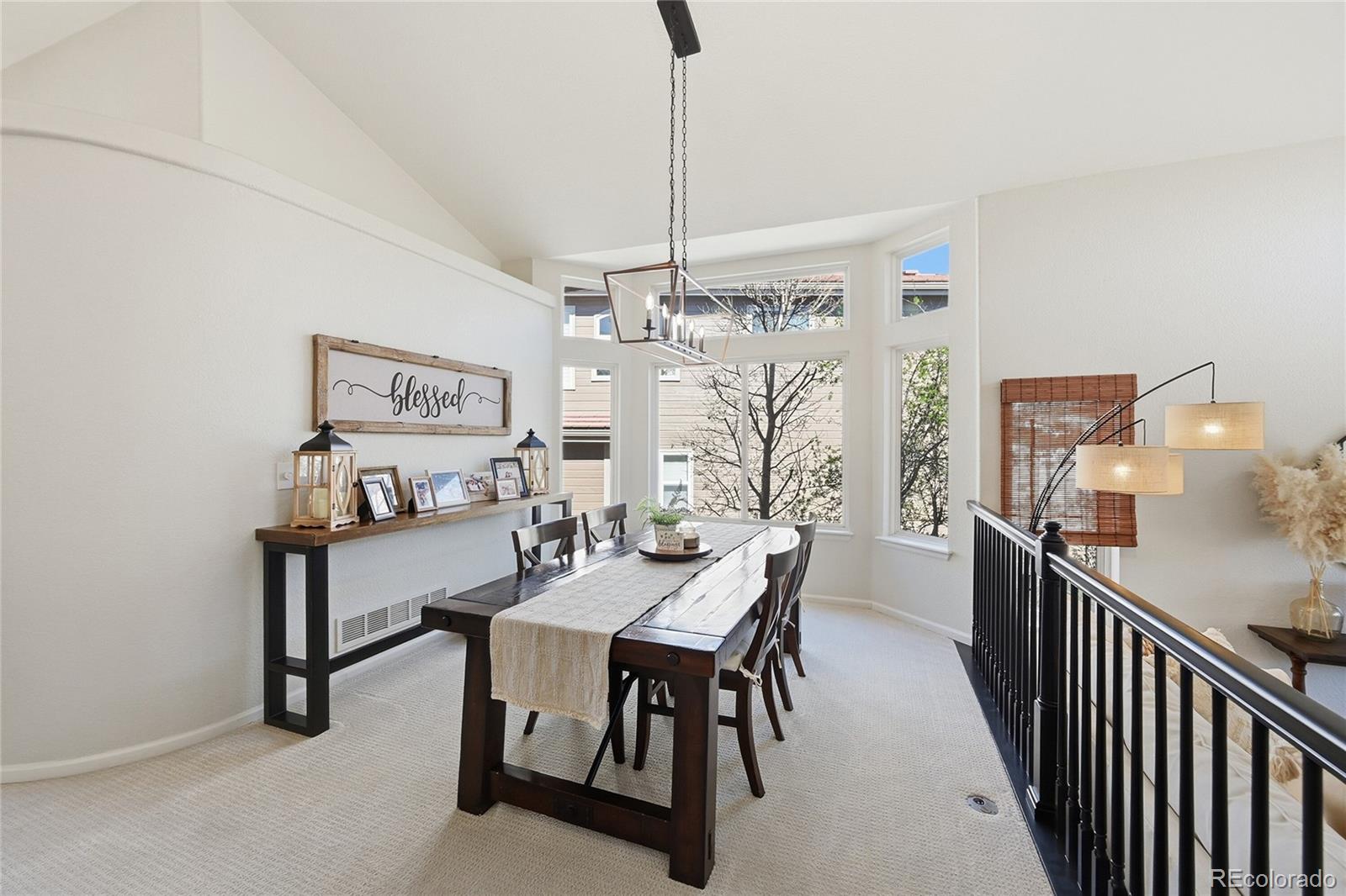 9153 Roadrunner Drive Highlands Ranch, CO 80129 - Photo 9 of 39 a view of a dining room with furniture