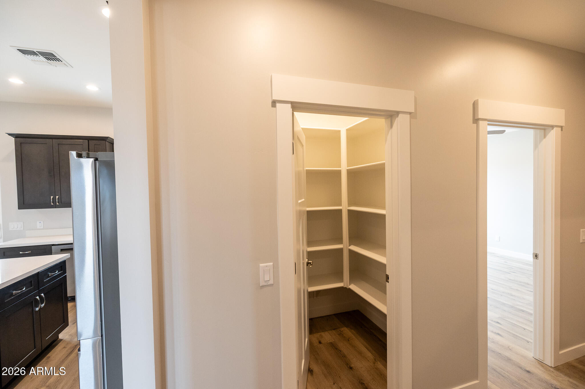 11459 East Adamsville Road Florence, AZ 85132 - Photo 26 of 63 a view of a walk in closet and bedroom