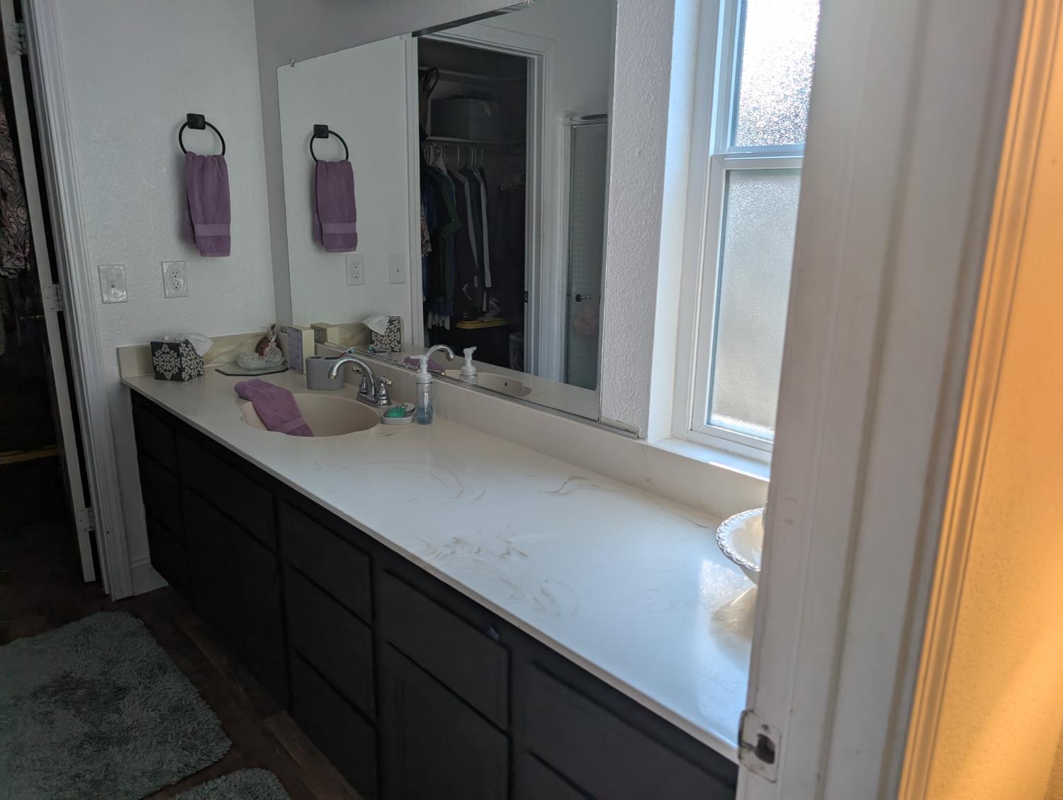 5637 Chris Ann Court Sacramento, CA 95841 - Photo 12 of 23 a bathroom with a sink and a mirror