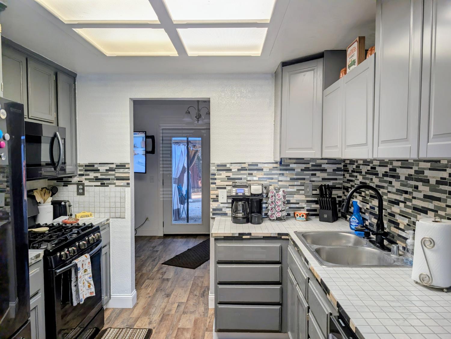 5637 Chris Ann Court Sacramento, CA 95841 - Photo 3 of 23 a kitchen with refrigerator and stove