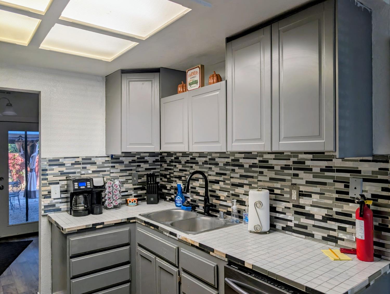 5637 Chris Ann Court Sacramento, CA 95841 - Photo 5 of 23 a kitchen with a sink and cabinets