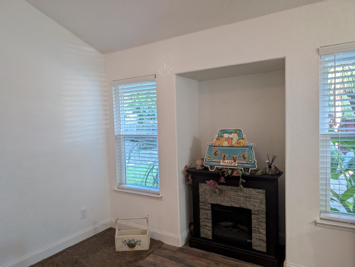 5637 Chris Ann Court Sacramento, CA 95841 - Photo 7 of 23 a living room with a fireplace and a window