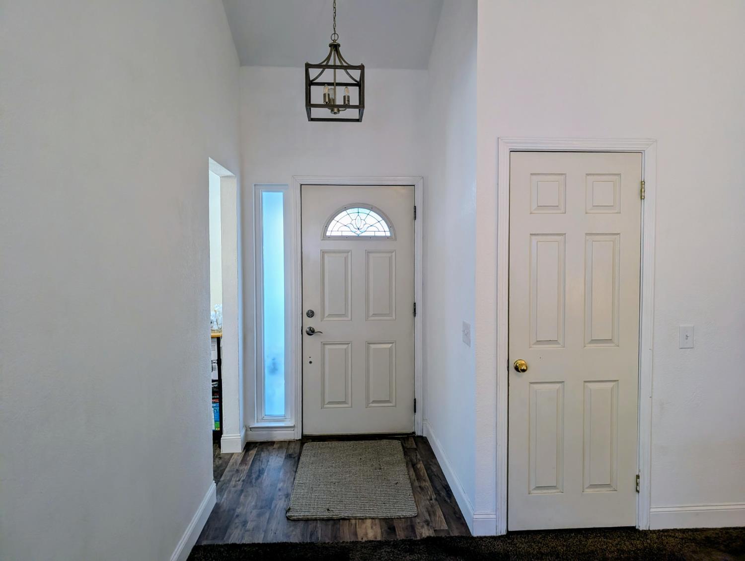 5637 Chris Ann Court Sacramento, CA 95841 - Photo 9 of 23 a view of a hallway with wooden floor and closet