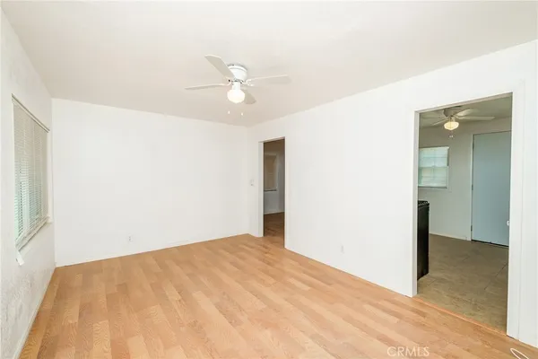 a kitchen with granite countertop white cabinets and a stove