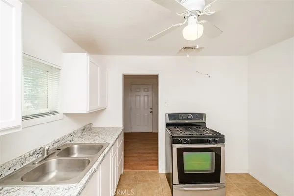 a view of a kitchen with marble kitchen and sink